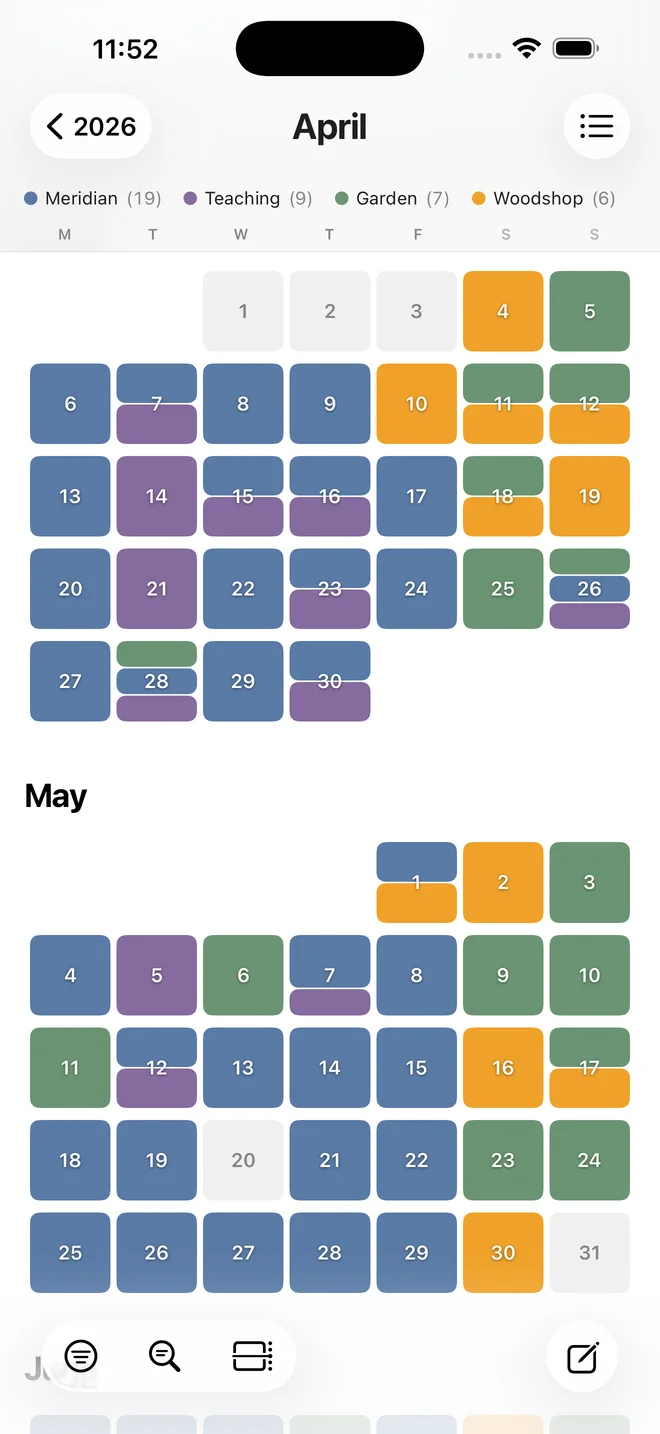 The Almanac on iPhone. Months as a grid of days, colored by channel.